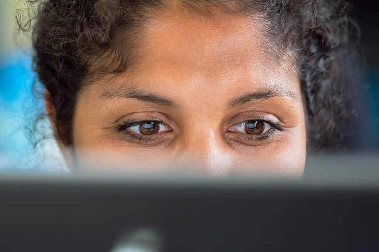 Woman looking at a computer